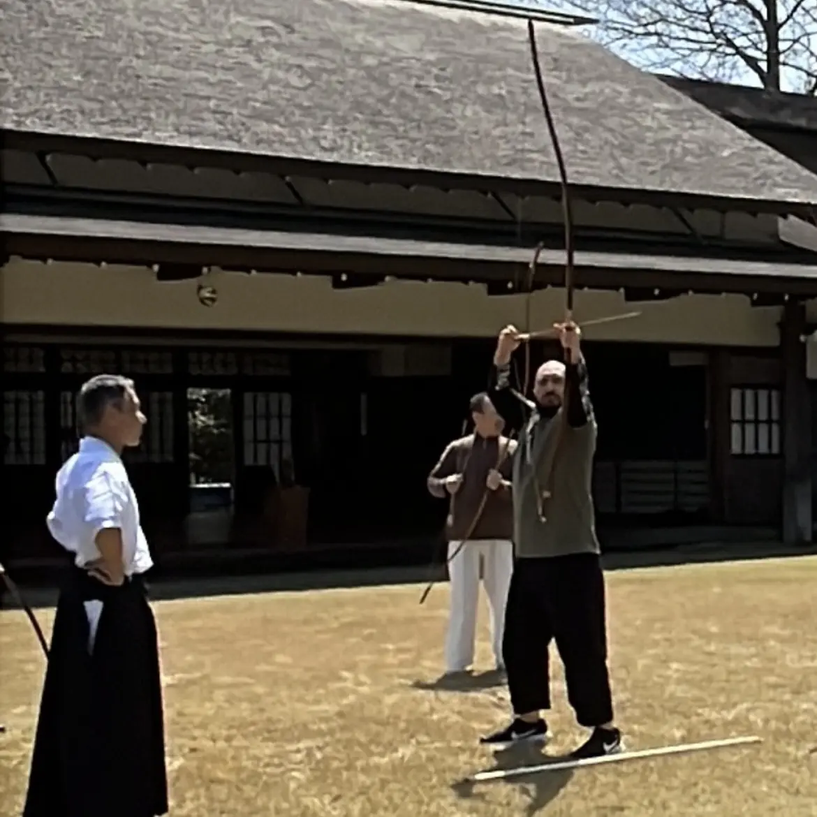 Olgun in a Kyudo (Japanese archery) dojo in Mie Prefecture Japan with Urano Yuji Sensei [7th Dan Kyudo]